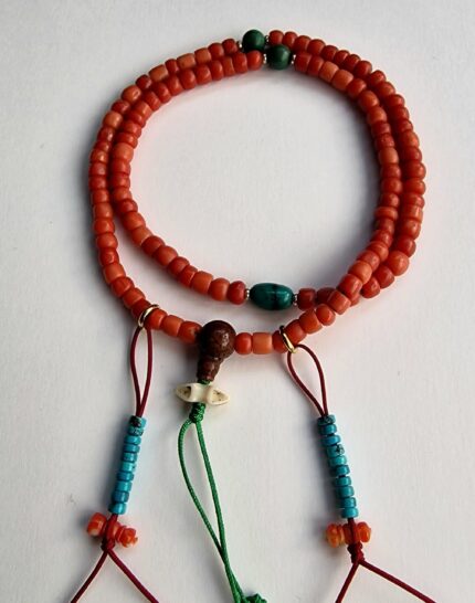 Hand-polished red coral prayer beads featuring natural turquoise spacers.