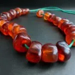 Hand-strung Baltic amber beads bracelet showing natural honey-gold transparency and inclusions.