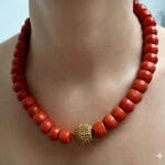 Hand-polished antique coral beads with authentic gold spacers and ritual patina.