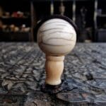 Hand-carved ivory-tone bone guru bead with a smooth ritual patina.