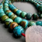 Hand-knotted Turquoise Mala necklace featuring 108 natural gemstone beads and a matching guru bead.