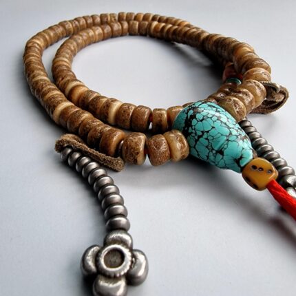 Hand-carved Kapala skull prayer beads with a rich ritual patina.