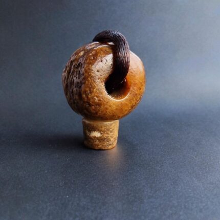 Hand-carved bone Kapala guru bead with a rich ritual patina.