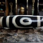 Antique 2-eyed Tibetan Dzi bead closeup