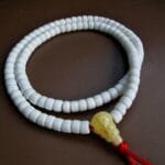 Antique Tibetan conch shell prayer beads with a rich ritual patina.