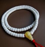 Antique Tibetan conch shell prayer beads with a rich ritual patina.