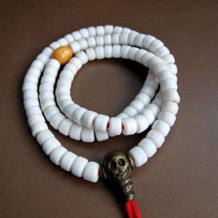 Antique 108 Conch Shell Mala featuring hand-carved white disk beads with a smooth ritual patina.