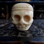 Antique Tibetan Guru bead with a rich ritual patina and traditional two-part construction.