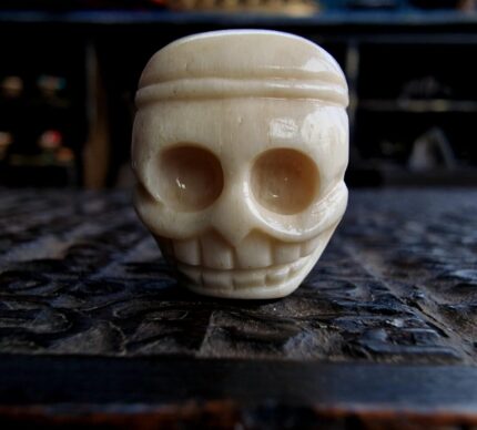 Antique Tibetan Guru bead with a rich ritual patina and traditional two-part construction.