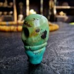 Hand-carved turquoise Guru bead set featuring a natural blue-green matrix and ritual hole.