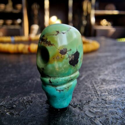 Hand-carved turquoise Guru bead set featuring a natural blue-green matrix and ritual hole.