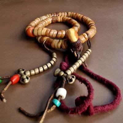 Authentic Tibetan bone mala featuring 108 antique yak bone beads with a smooth ritual patina.