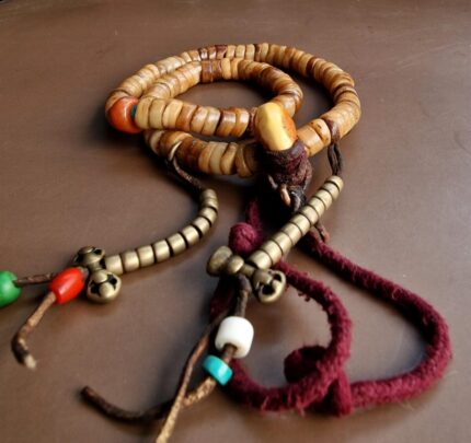 Authentic Tibetan bone mala featuring 108 antique yak bone beads with a smooth ritual patina.