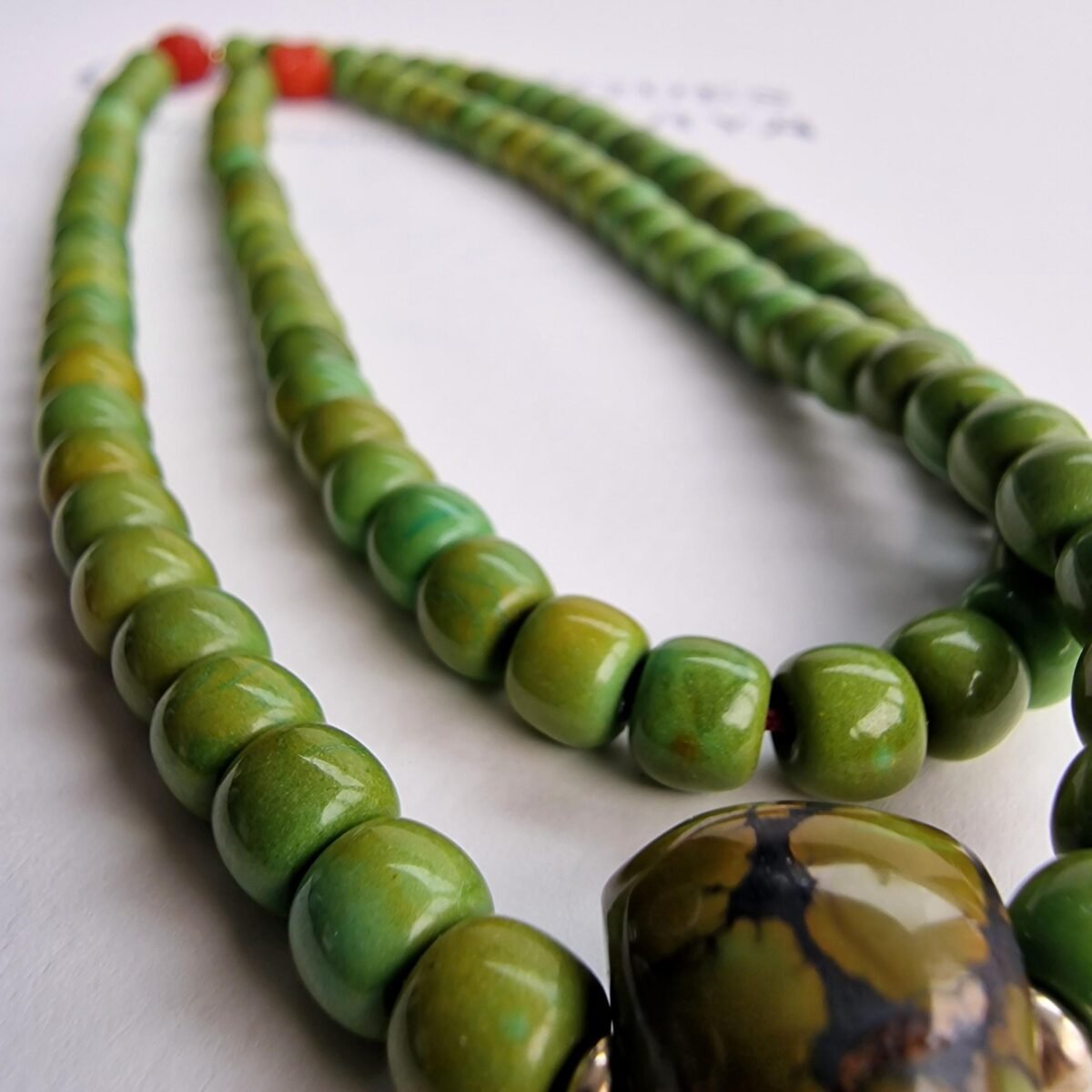 Hand-strung turquoise prayer beads featuring natural blue-green stones with a rich matrix.