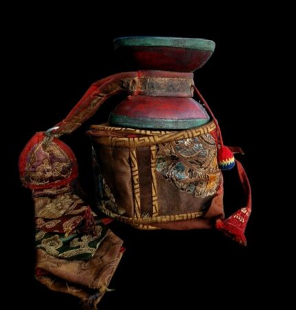 Antique Tibetan Damaru hand drum featuring authentic ritual bone or wood.