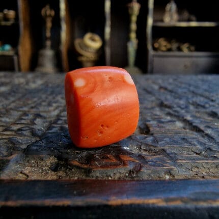 Antique Himalayan coral bead turquoise inlay barrel shape with natural imperfections and deep patina.
