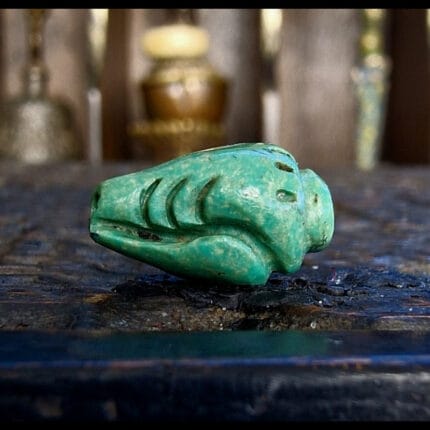 Tibetan turquoise conch bead hand-carved shell shape with aged green patina and ritual markings