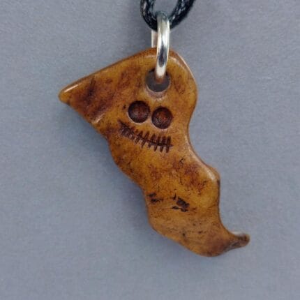 Tibetan Kapala skull amulet ritual bone hand-carved with dark aged patina.