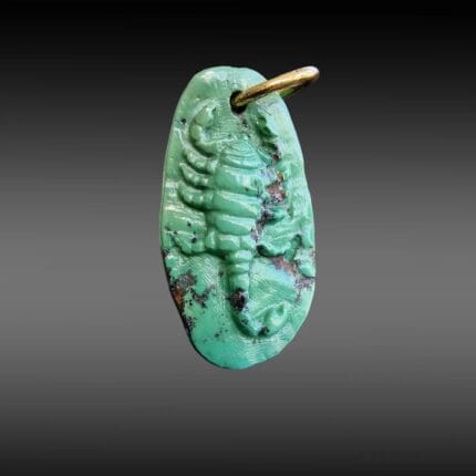 Tibetan turquoise scorpion hand-carved antique amulet with visible dark matrix and metal ring.