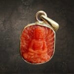 Himalayan Coral Buddha Pendant – Hand-Carved Tibetan Buddha Amulet
​A source of deep compassion and grounding clarity.